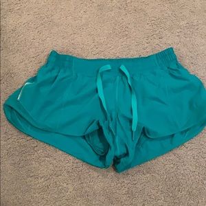 Teal lulu lemon shorts with reflective line